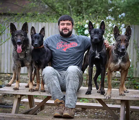 dion burke frome k9 team member with his dogs